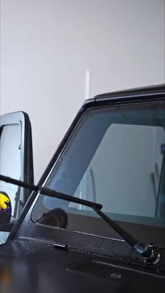 Close-up of a Mercedes G-Wagon windshield and wiper, where windshield protection film is applied