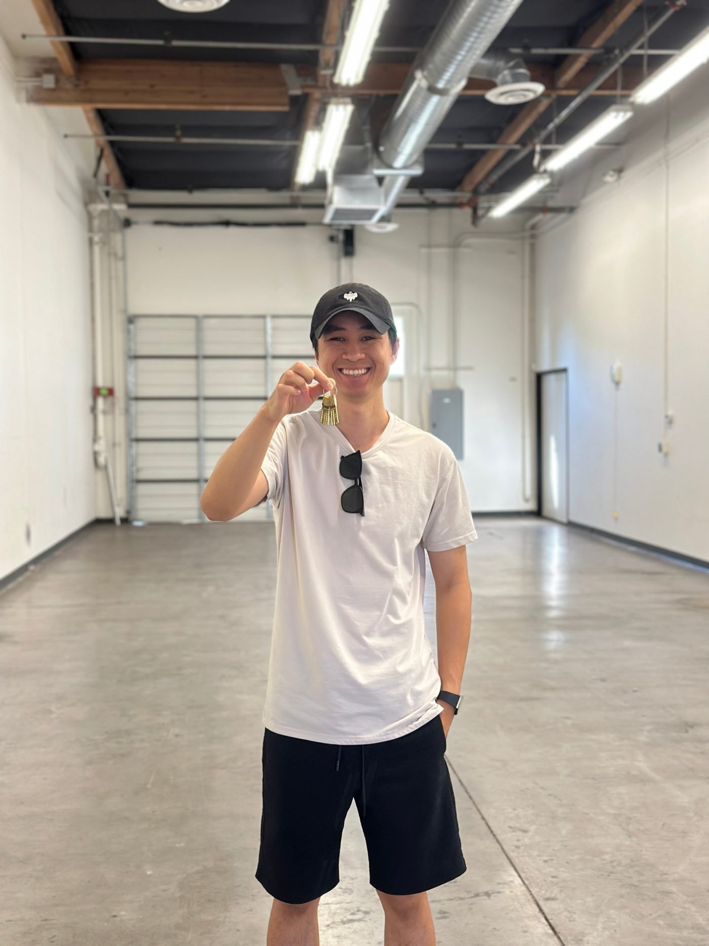 John Le holding the keys to the new Phantom Tint shop in Mesa, AZ