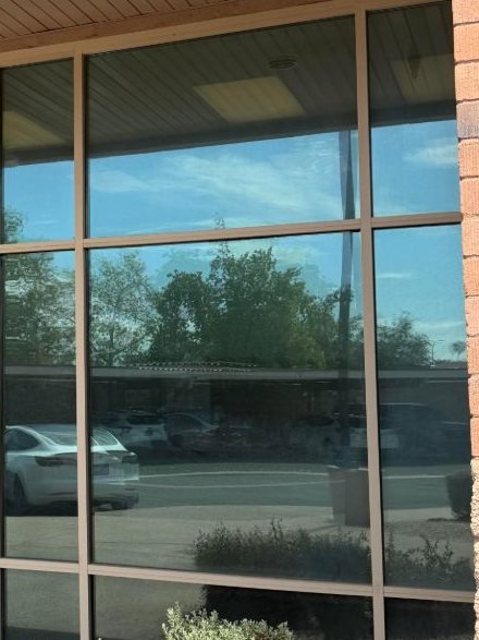 Reflective window film on the storefront windows of a Tempe, AZ office building