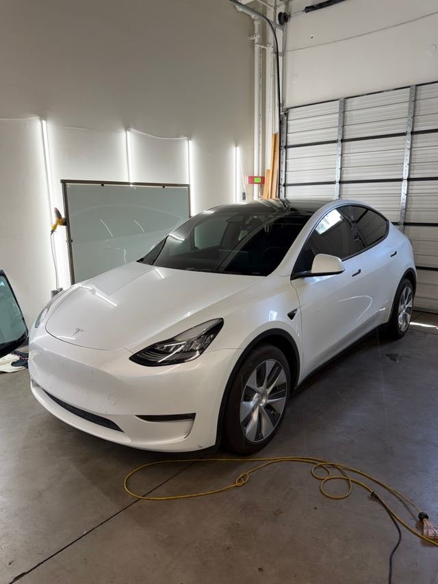 White Tesla Model Y with Phantom Tint