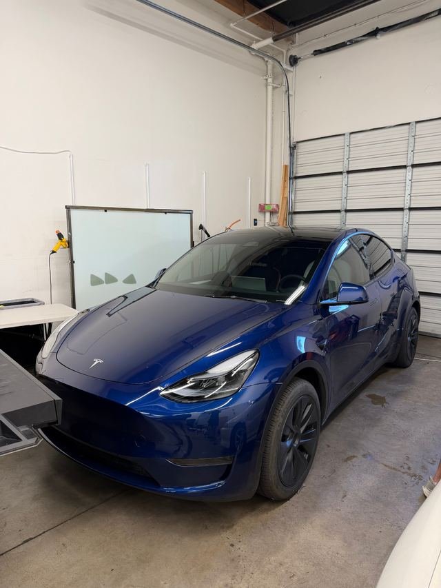 Blue Tesla Model Y with Phantom Tint
